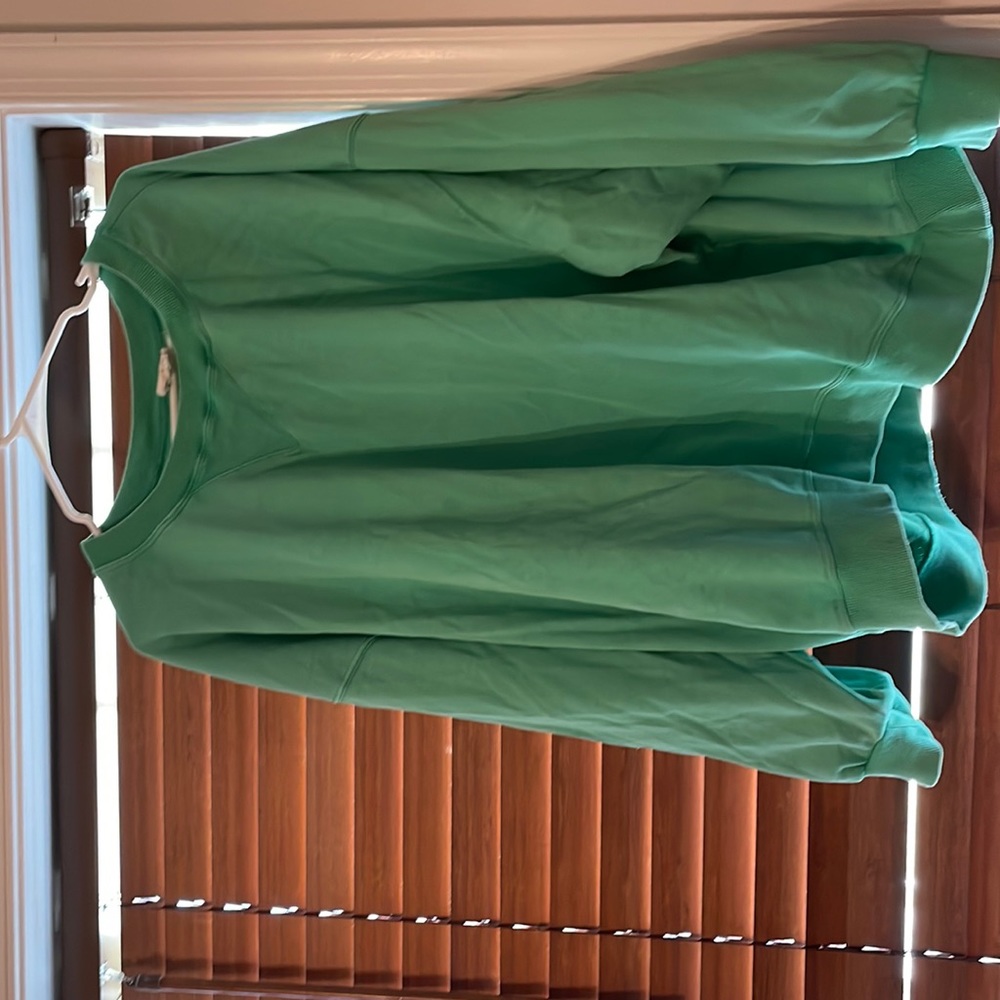 Oversized bright green sweatshirt.